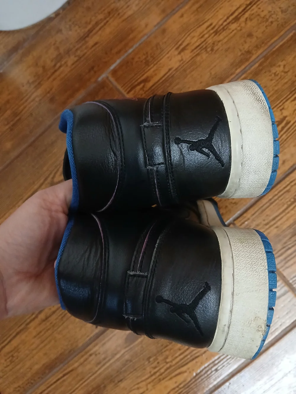 Classic Air Jordan high tops. Black with pink wing logo and blue